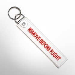 Брелок Remove Before Flight белый