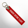 Брелок Remove Before Flight красный